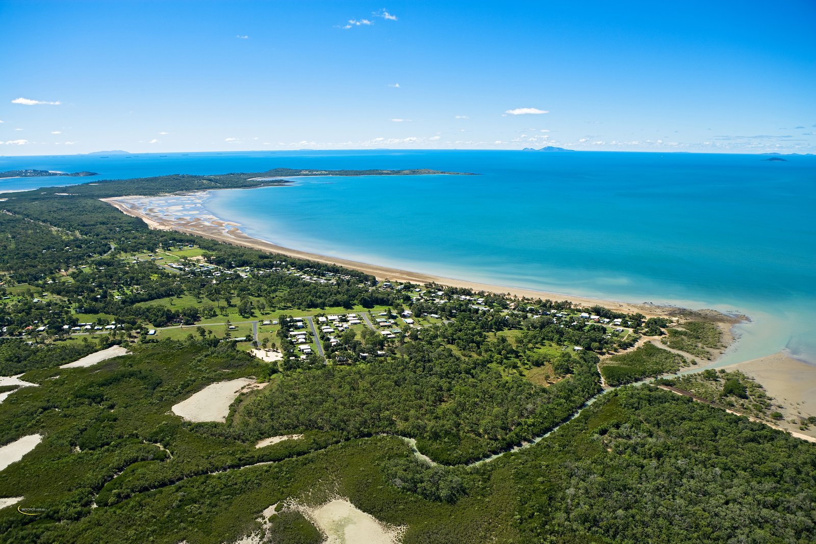 Aerial drone photograph of Armstrong Beach, Queensland — Turquoise Waters Estate and the Coral Sea toward the Great Barrier Reef
